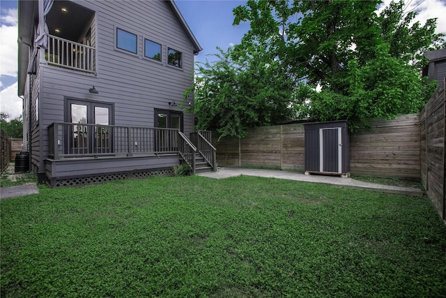 3323 Cornell St, Houston, TX 77022 - rear view of house with a fenced backyard, a wooden deck, and a patio area