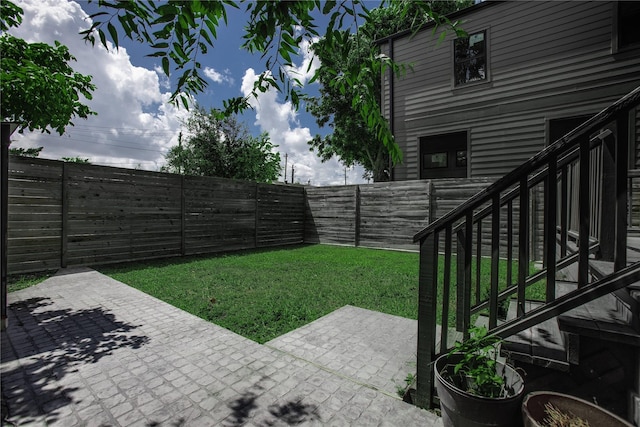 3323 Cornell St, Houston, TX 77022 - fenced backyard featuring a patio area and stairs
