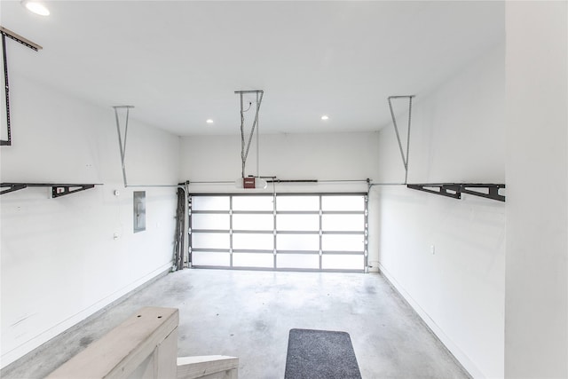 3323 Cornell St, Houston, TX 77022 - garage featuring electric panel, a garage door opener, and recessed lighting
