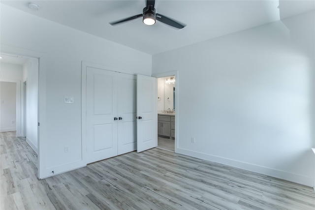 3323 Cornell St, Houston, TX 77022 - unfurnished bedroom with light wood-style floors, a closet, ensuite bathroom, and ceiling fan