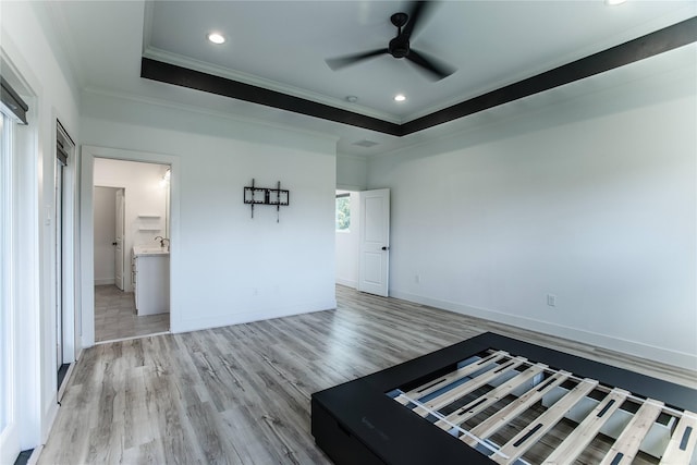 3323 Cornell St, Houston, TX 77022 - spare room with crown molding, light wood-style flooring, ceiling fan, recessed lighting, and a raised ceiling