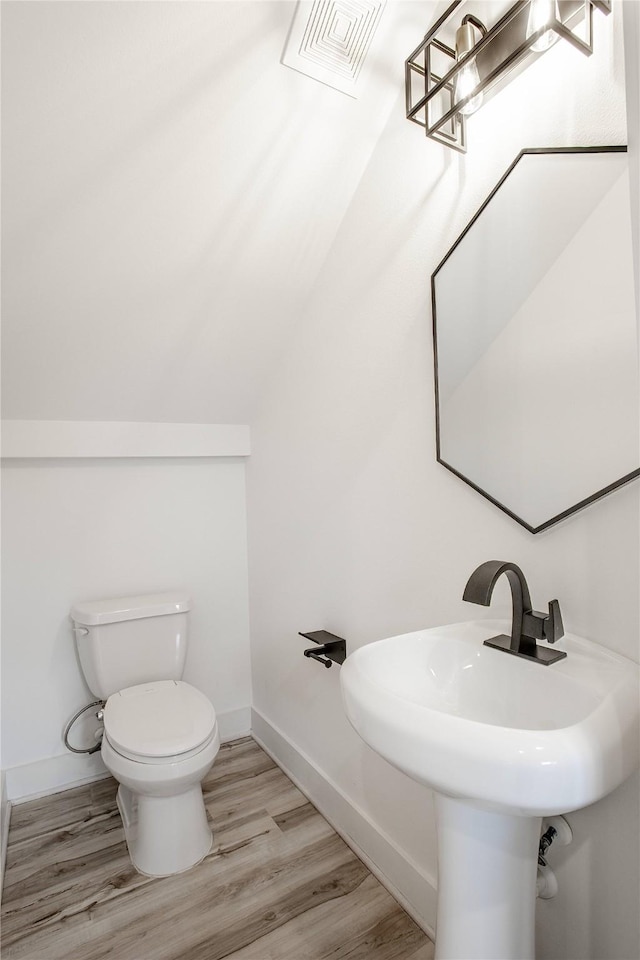 3323 Cornell St, Houston, TX 77022 - half bath with toilet and wood finished floors
