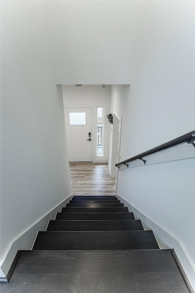 3323 Cornell St, Houston, TX 77022 - stairs featuring wood finished floors and baseboards