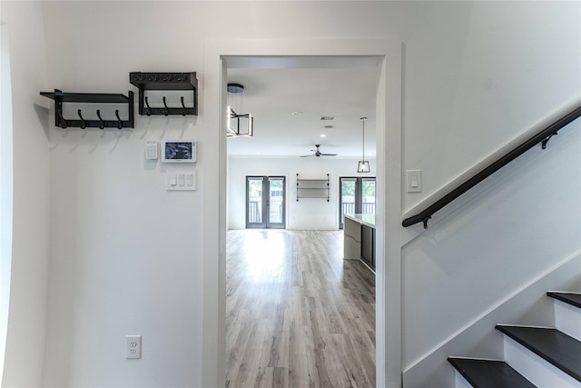 3323 Cornell St, Houston, TX 77022 - staircase featuring a ceiling fan and wood finished floors