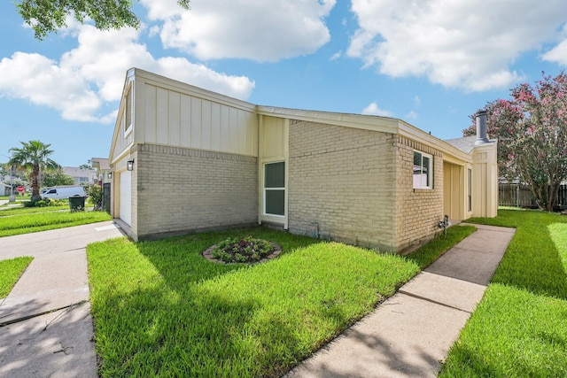 6315 Dellfern Dr, Houston, TX 77035 - view of side of home with brick siding, an attached garage, and concrete driveway