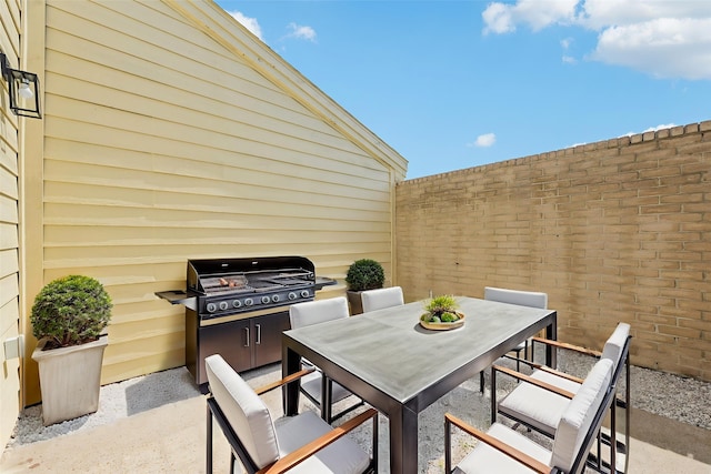 6315 Dellfern Dr, Houston, TX 77035 - view of patio / terrace with outdoor dining space and a grill