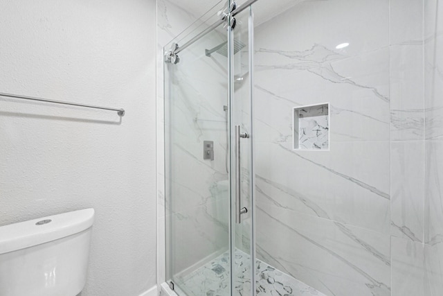 6315 Dellfern Dr, Houston, TX 77035 - full bathroom featuring toilet and a marble finish shower