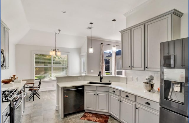 3115 Sable Xing, San Antonio, TX 78232 - kitchen with dishwashing machine, fridge with ice dispenser, stainless steel gas stove, vaulted ceiling, and a peninsula