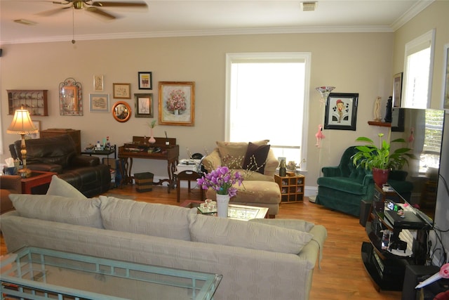 11014 Indian Trails Dr, Tomball, TX 77375 - living room with a ceiling fan, light wood-style flooring, and ornamental molding