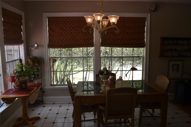11014 Indian Trails Dr, Tomball, TX 77375 - dining area featuring a chandelier and baseboards