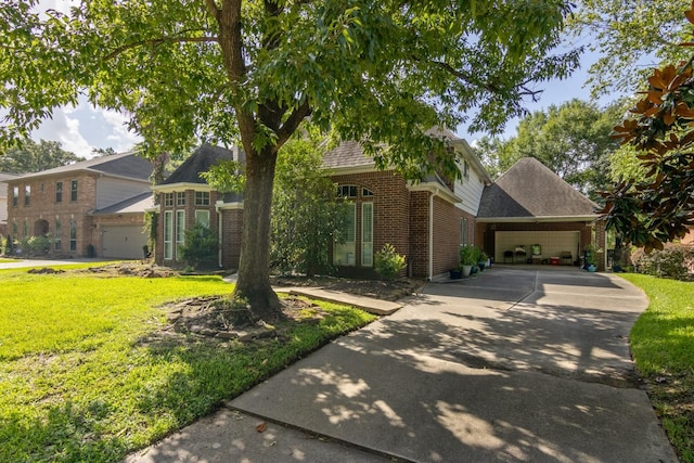 8414 Atascocita Lake Way, Humble, TX 77346 - view of front of house with brick siding, driveway, a front yard, and an attached garage