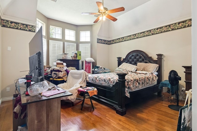 8414 Atascocita Lake Way, Humble, TX 77346 - bedroom featuring wood finished floors and ceiling fan