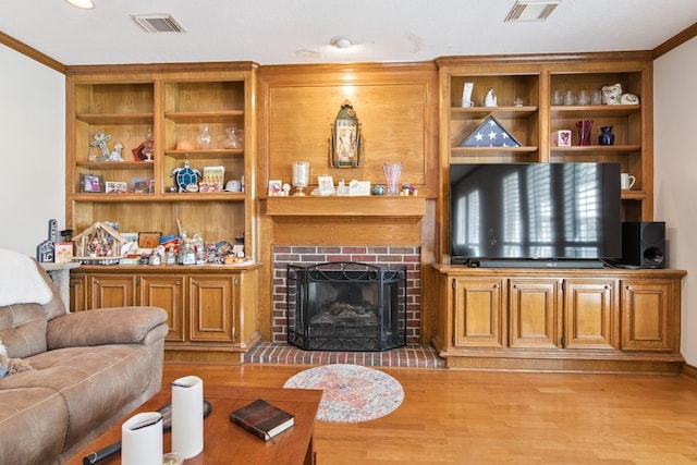 8414 Atascocita Lake Way, Humble, TX 77346 - living area with light wood-style floors and a brick fireplace