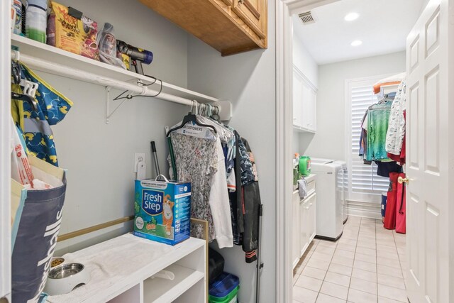 8414 Atascocita Lake Way, Humble, TX 77346 - walk in closet featuring washer and dryer and light tile patterned floors