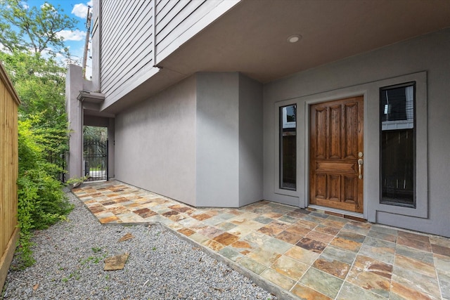 709 Lester St, Houston, TX 77007 - entrance to property featuring stucco siding and a patio area