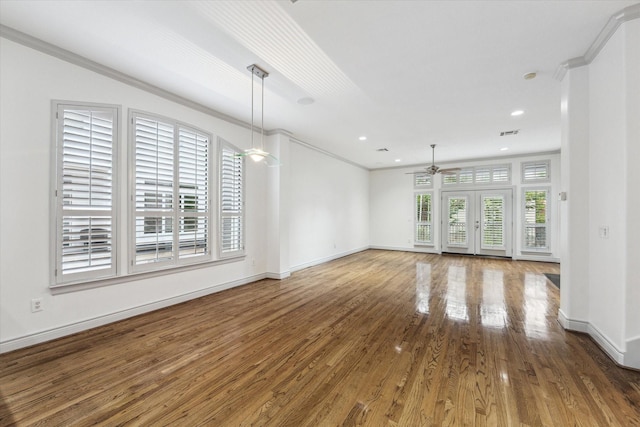 709 Lester St, Houston, TX 77007 - unfurnished living room with a ceiling fan, wood finished floors, recessed lighting, and crown molding