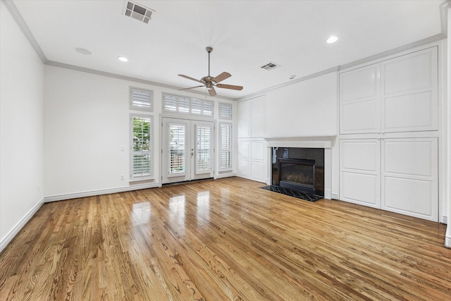 709 Lester St, Houston, TX 77007 - unfurnished living room featuring ornamental molding, a ceiling fan, light wood finished floors, a premium fireplace, and recessed lighting