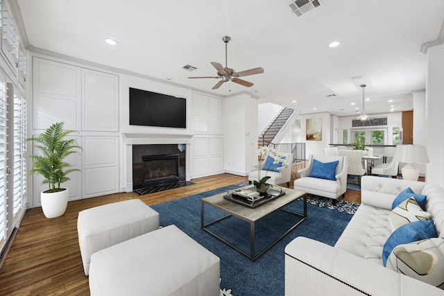 709 Lester St, Houston, TX 77007 - living room with a ceiling fan, wood finished floors, stairs, recessed lighting, and a fireplace with flush hearth