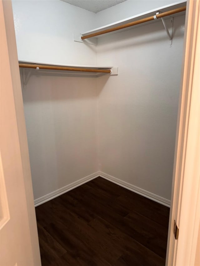 9412 Riviera Dr, Waco, TX 76712 - spacious closet featuring dark wood-style floors