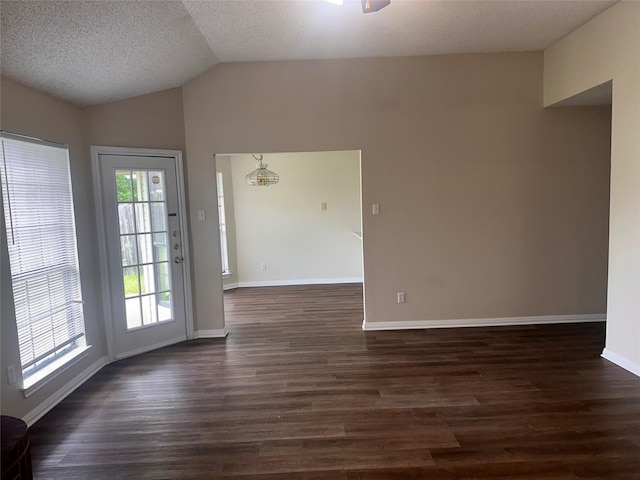 9412 Riviera Dr, Waco, TX 76712 - unfurnished room with lofted ceiling, dark wood finished floors, a textured ceiling, and ceiling fan
