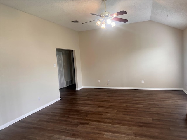 9412 Riviera Dr, Waco, TX 76712 - spare room featuring lofted ceiling, a textured ceiling, a ceiling fan, and dark wood-type flooring