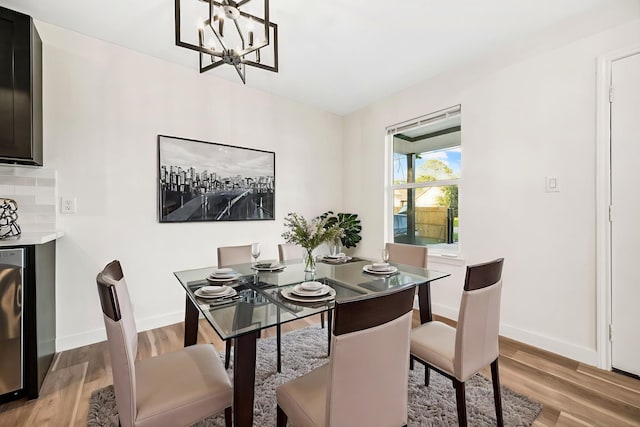 6321 Joe Louis Ln, Houston, TX 77091 - dining area with light wood-style flooring and a chandelier
