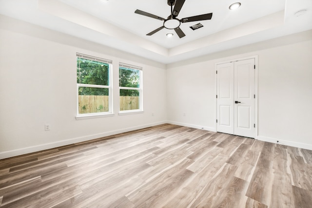 6321 Joe Louis Ln, Houston, TX 77091 - empty room featuring ceiling fan, light wood-type flooring, recessed lighting, and a raised ceiling