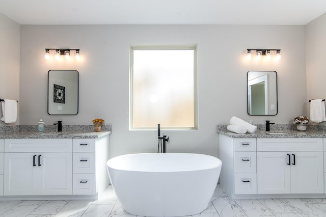 4910 Wunder Way, Houston, TX 77069 - full bathroom with marble finish floors, two vanities, and a soaking tub