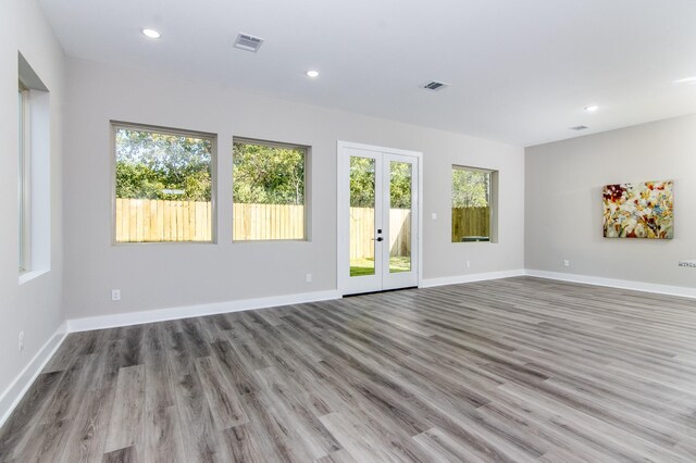 4910 Wunder Way, Houston, TX 77069 - spare room featuring french doors, wood finished floors, and recessed lighting