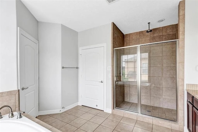 3204 Garden Oaks Vw, Houston, TX 77018 - bathroom featuring a shower stall, a bath, tile patterned floors, and vanity