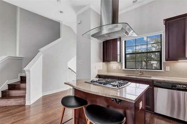 3204 Garden Oaks Vw, Houston, TX 77018 - kitchen featuring appliances with stainless steel finishes, wall chimney exhaust hood, dark wood finished floors, a center island, and backsplash