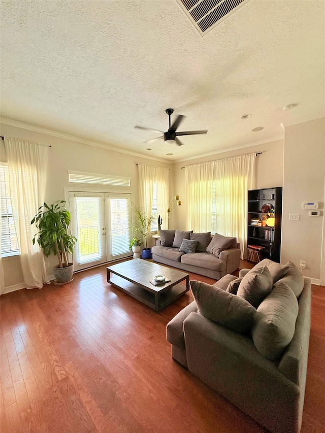 3204 Garden Oaks Vw, Houston, TX 77018 - living area with a textured ceiling, wood finished floors, a ceiling fan, ornamental molding, and french doors