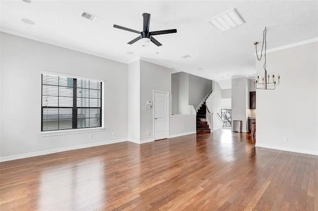 3204 Garden Oaks Vw, Houston, TX 77018 - unfurnished living room with wood finished floors, stairs, a ceiling fan, a chandelier, and crown molding
