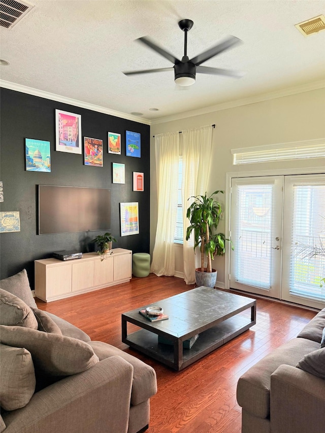 3204 Garden Oaks Vw, Houston, TX 77018 - living area featuring a ceiling fan, ornamental molding, wood finished floors, french doors, and a textured ceiling