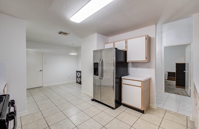 3618 Teakwood Ln, Pearland, TX 77584 - kitchen with appliances with stainless steel finishes, light tile patterned floors, light countertops, and a textured ceiling