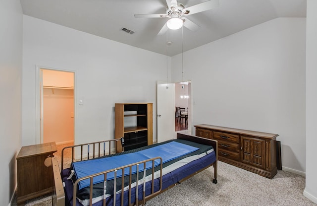 3618 Teakwood Ln, Pearland, TX 77584 - bedroom with carpet flooring, vaulted ceiling, a walk in closet, and a ceiling fan