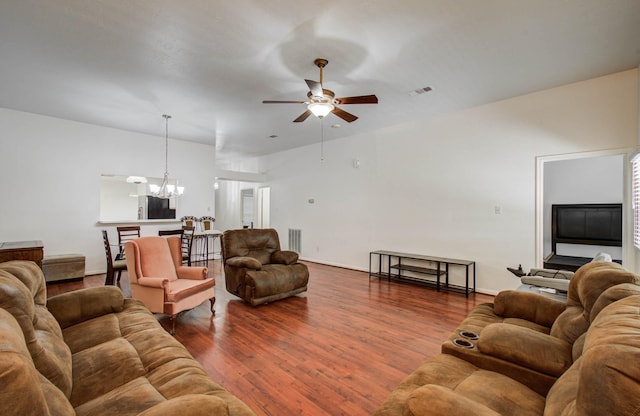 3618 Teakwood Ln, Pearland, TX 77584 - living area with a chandelier, ceiling fan, and dark wood-style flooring