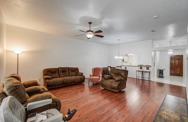3618 Teakwood Ln, Pearland, TX 77584 - living room featuring a ceiling fan, wood finished floors, and a chandelier