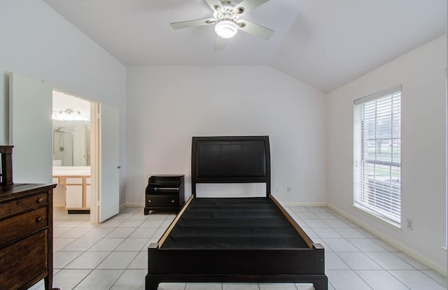3618 Teakwood Ln, Pearland, TX 77584 - bedroom featuring multiple windows, light tile patterned floors, lofted ceiling, ensuite bath, and ceiling fan