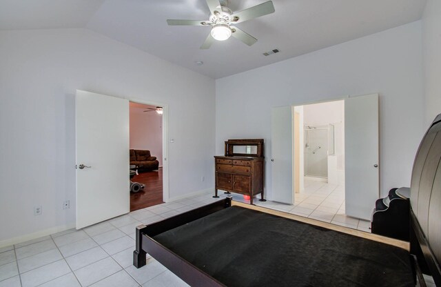 3618 Teakwood Ln, Pearland, TX 77584 - bedroom featuring light tile patterned flooring, vaulted ceiling, a ceiling fan, and connected bathroom