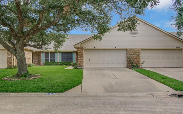 3618 Teakwood Ln, Pearland, TX 77584 - view of front of property with brick siding, a front lawn, concrete driveway, and a garage