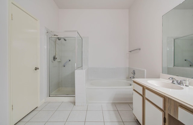 3618 Teakwood Ln, Pearland, TX 77584 - bathroom featuring a bath, a stall shower, tile patterned flooring, and vanity
