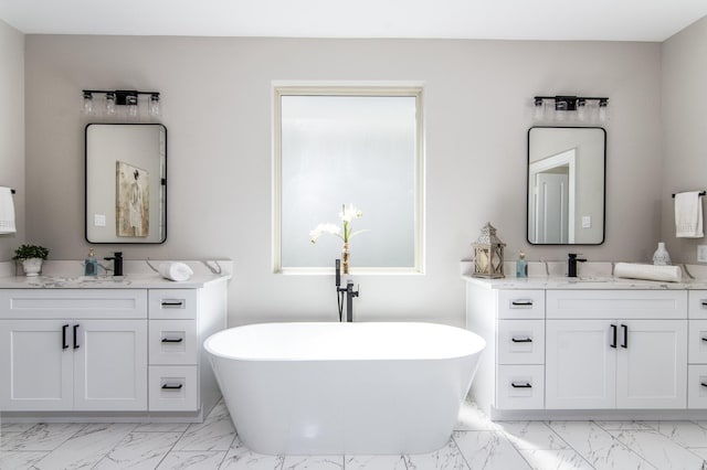 15034 Wunderlust Ln, Houston, TX 77069 - bathroom with marble finish flooring, two vanities, and a freestanding bath