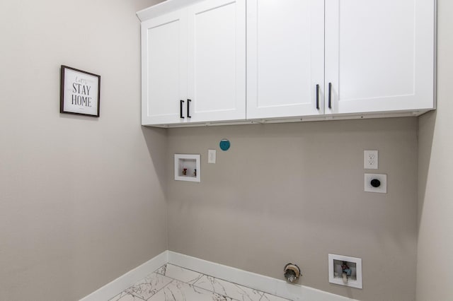 15034 Wunderlust Ln, Houston, TX 77069 - washroom with electric dryer hookup, washer hookup, cabinet space, light marble finish floors, and gas dryer hookup