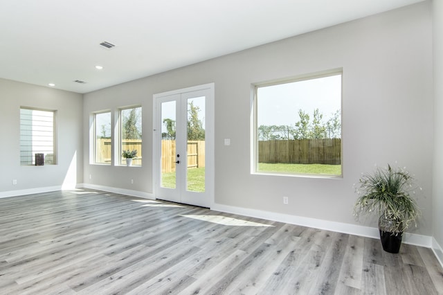 15034 Wunderlust Ln, Houston, TX 77069 - spare room with french doors, wood finished floors, and recessed lighting