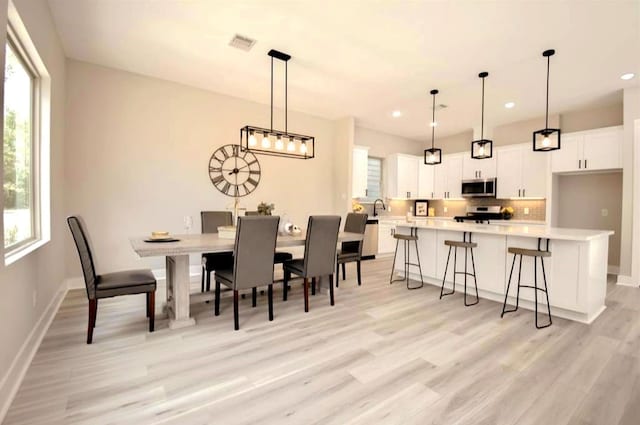 15034 Wunderlust Ln, Houston, TX 77069 - dining area featuring light wood-style floors and recessed lighting