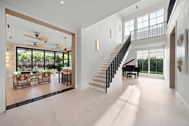 3649 Chevy Chase Dr, Houston, TX 77019 - stairway with a ceiling fan, recessed lighting, and a high ceiling