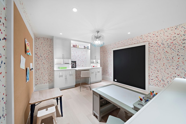 3649 Chevy Chase Dr, Houston, TX 77019 - home office with wallpapered walls, recessed lighting, light wood-style floors, and a chandelier