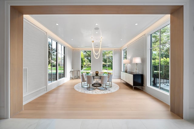 3649 Chevy Chase Dr, Houston, TX 77019 - dining room featuring crown molding, plenty of natural light, and light wood-style flooring