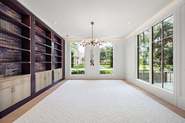 3649 Chevy Chase Dr, Houston, TX 77019 - empty room with crown molding, a chandelier, and light wood-type flooring